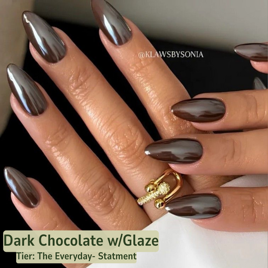 Nails with dark chocolate color and glaze, featuring a brand name.